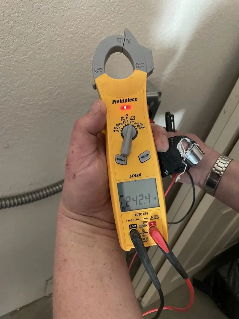 Voltage testing with clamp meter during Electrical Installation Services in Sand Lake